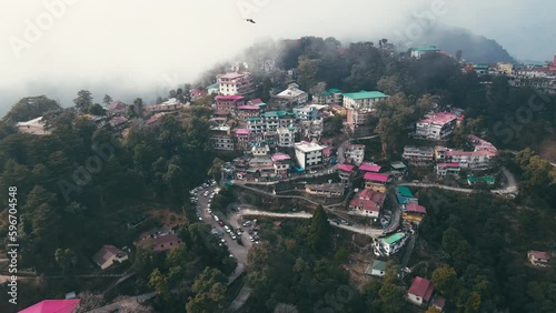 Aerial landscape view of Mussoorie hilltop peak city located in Uttarakhand, India with colorful buildings. Mussoorie Hill station near Dehradun in Uttarakhand Himalayan Range. photo
