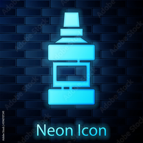 Glowing neon Mouthwash plastic bottle and glass icon isolated on brick wall background. Liquid for rinsing mouth. Oralcare equipment. Vector