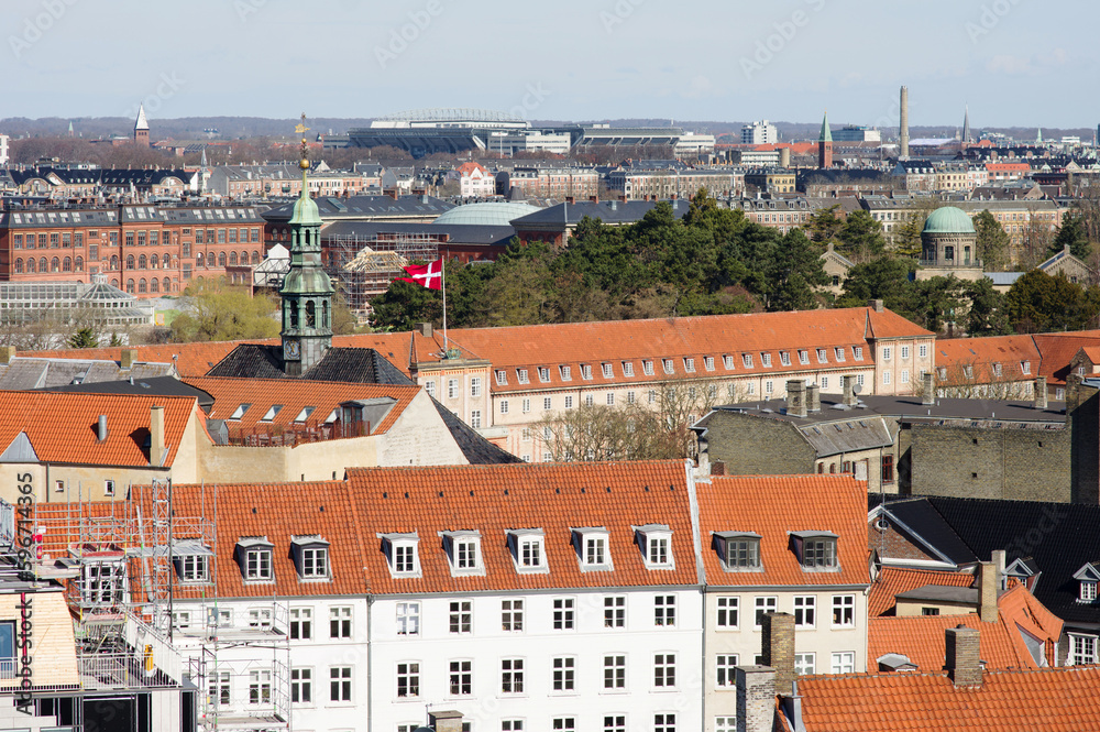 Aerial cityscape of the skyline of the center of Copenhagen with a large white building in the foreground in Denmark and a clear blue sky Aerial cityscape of the skyline of the center of Copenhagen with a large white building in the foreground in Denmark and a clear blue sky