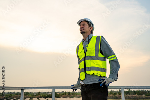 Engineer hand is installing and checking an operation of sun and cleanliness of photovoltaic solar panels, Engineer with energy measurement tool photovoltaic modules for renewable energy © FotoArtist