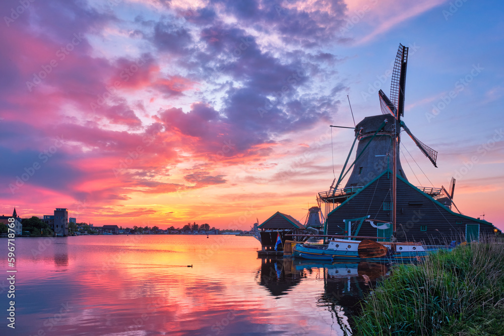 Windmills at Zaanse Schans in Holland on sunset. Zaandam, Nether Stock