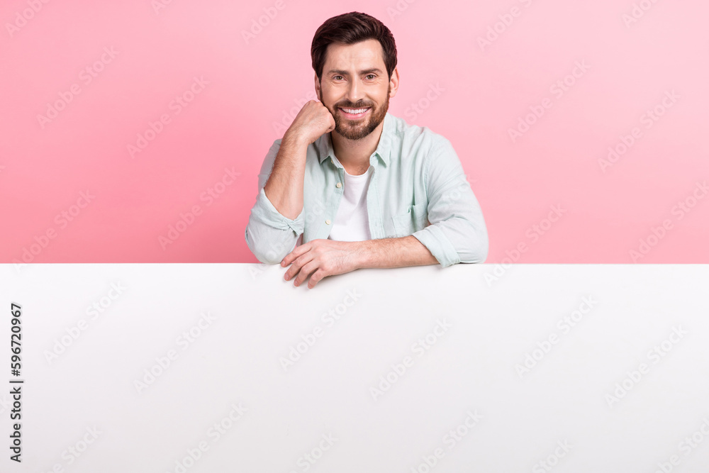 Photo of young cheerful successful entrepreneur touch cheeks smiling enjoy new product placement banner isolated on pink color background Photo of young cheerful successful entrepreneur touch cheeks smiling enjoy new product placement banner isolated on pink color background