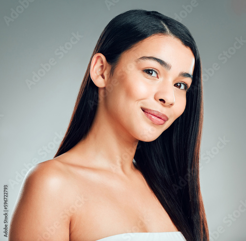 Shes stunning. Studio shot of a beautiful young woman with long brown hair.