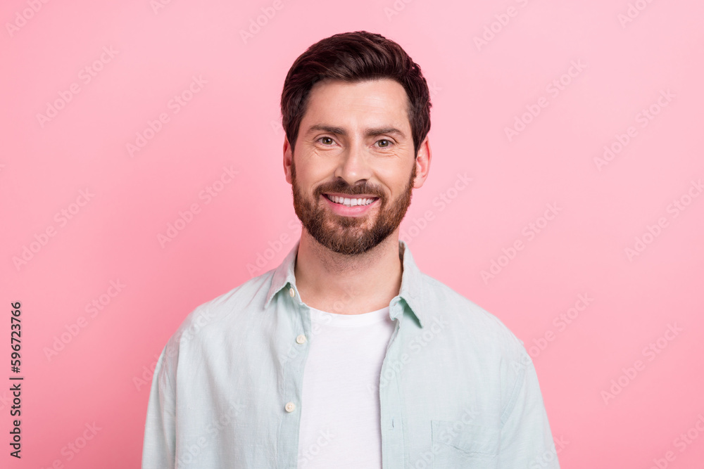 Photo portrait of handsome young guy toothy beaming smile face wear trendy blue outfit isolated on pink color background Photo portrait of handsome young guy toothy beaming smile face wear trendy blue outfit isolated on pink color background