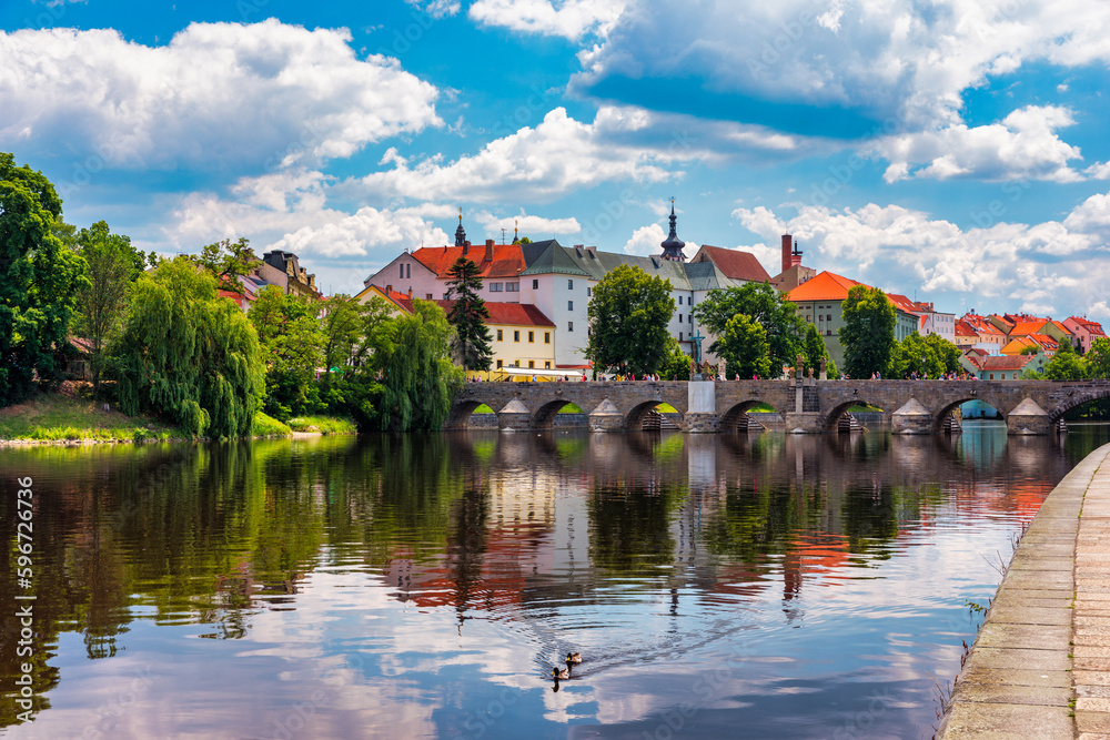 Medieval Town Pisek and historic stone bridge over river Otava in the Southern Bohemia, Czech Republic. Pisek Stone Bridge, the oldest preserved early Gothic bridge in the Czech republic.