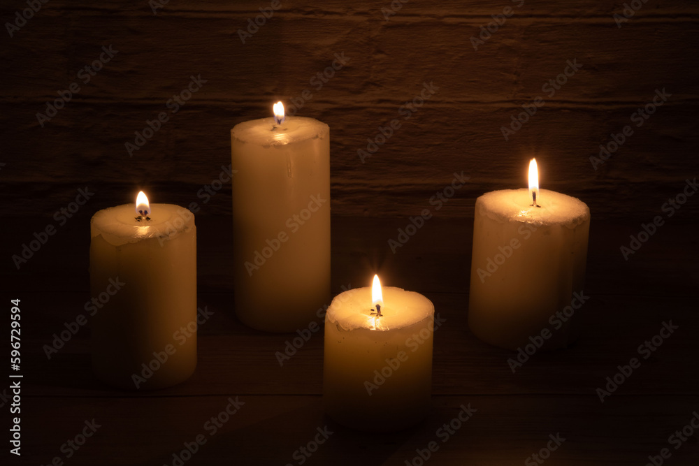 photo several burning candles on the table