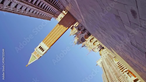 Camera shoots upside down St Mark square with Campanile photo