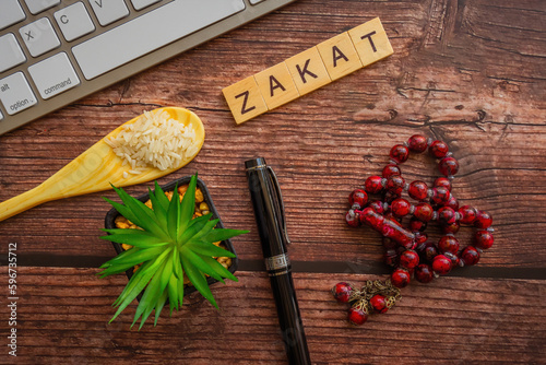 Conceptual zakat (islamic tax). Obligation to aid the poors. Islamic zakat concept. Selective focus.