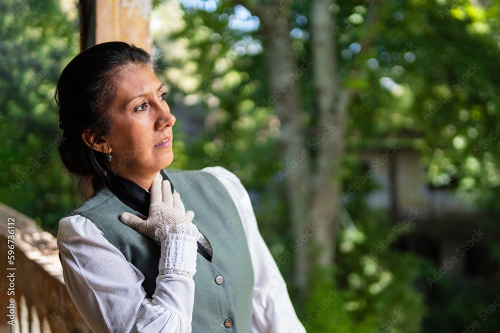 Profile portrait of a Latina woman dressed in traditional clothing, with a worried expression, her hand on her chest Profile portrait of a Latina woman dressed in traditional clothing, with a worried expression, her hand on her chest