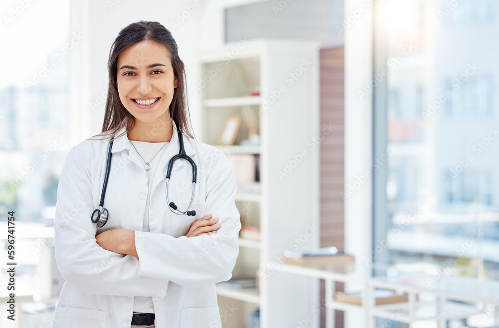 Healthcare is my expertise. Shot of a young female doctor standing with her arms crossed in her office at a hospital. Healthcare is my expertise. Shot of a young female doctor standing with her arms crossed in her office at a hospital.