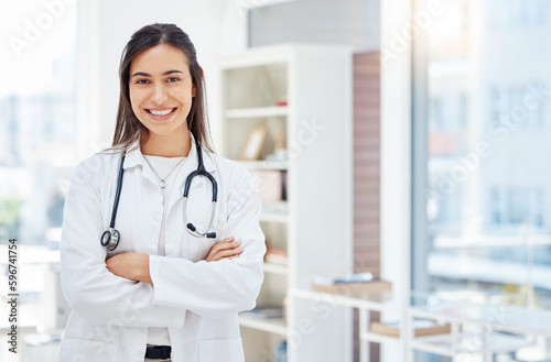 Healthcare is my expertise. Shot of a young female doctor standing with her arms crossed in her office at a hospital.