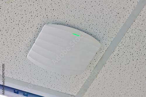wireless router for network, hang on the ceiling. world wide network technology. WIFI router or Wireless Access Point setup at ceiling for Internet connection space.