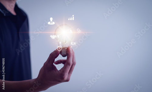 Hand holding light bulb global internet connection, digital marketing Finance and Banking, Digital link tech, Global Business Internet Connection.