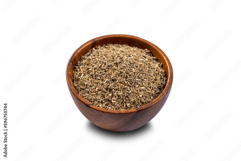 Anise seed on wooden bowl. 45 degrees studio shoot isolated on white background. Anise seed on wooden bowl. 45 degrees studio shoot isolated on white background.