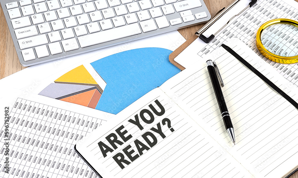 ARE YOU READY text on notebook with chart and keyboard ARE YOU READY text on notebook with chart and keyboard