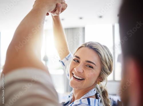 Wifes joyful face while dancing with husband at home. Romantic couple celebrating anniversary, enjoying tender moment