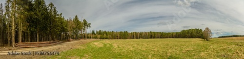 panorama of countryside with forest, meadow, wood, path