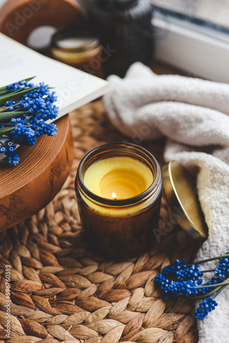 Candle and flowers in home atmospheric interior