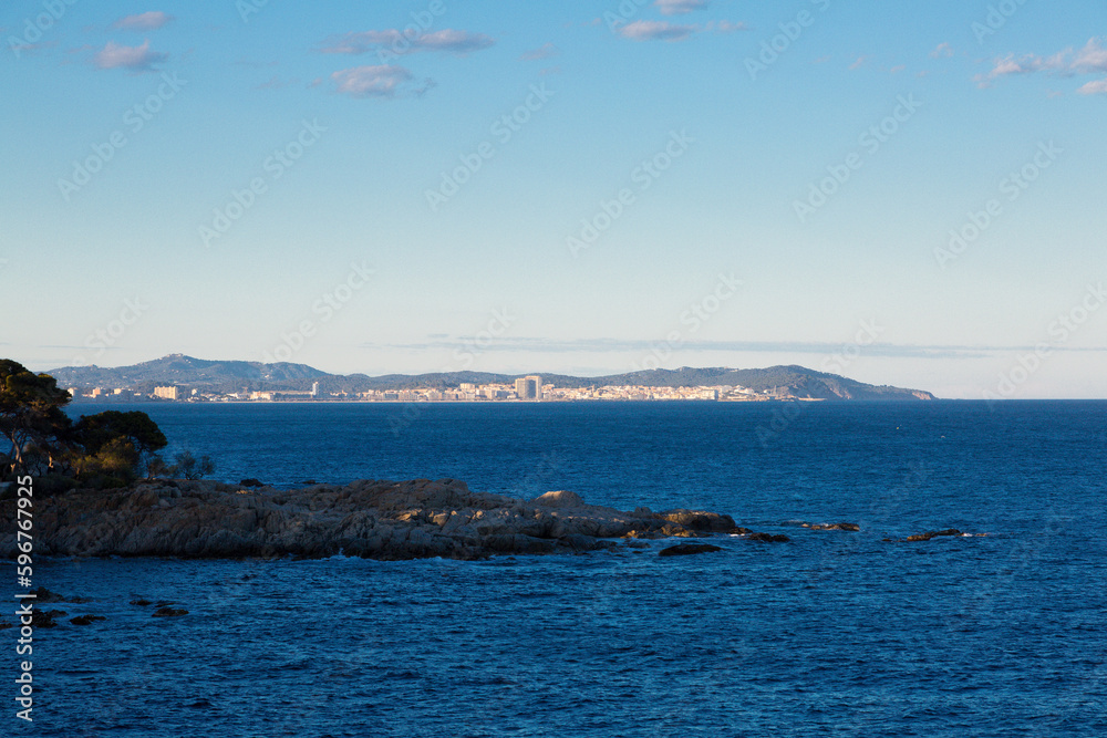 View on the horizon of the coastal town of Palamós, Girona in the Ampurdan, Costa Brava, Spain.