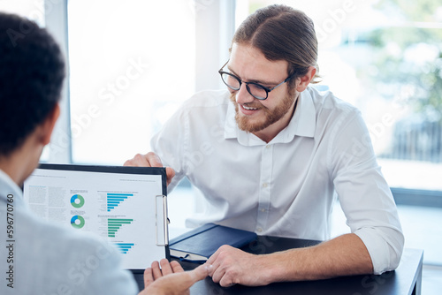 Performance everyones chuffed with. Shot of two businesspeople having a meeting in a boardroom.