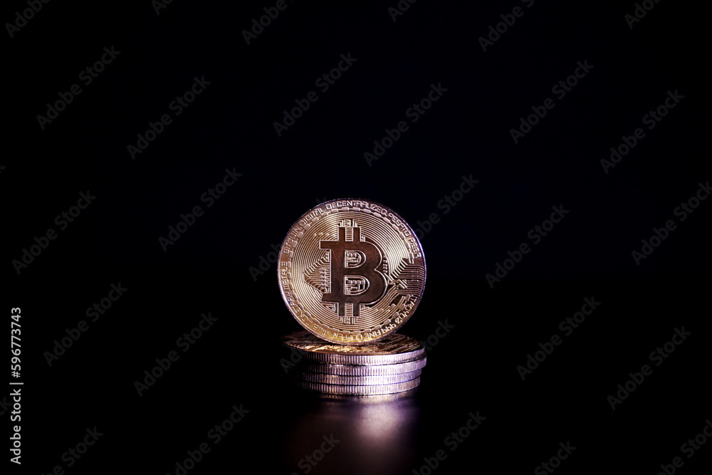 gold bitcoin on black background with selective focus gold bitcoin on black background with selective focus