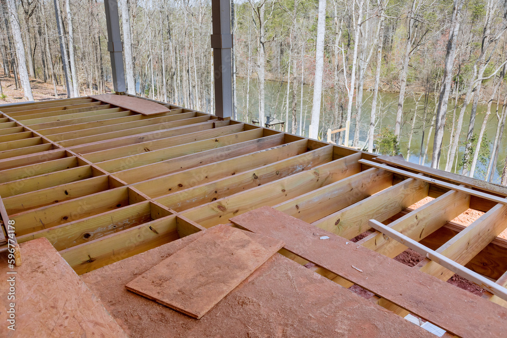 In new built custom home new flooring joists were constructed for wooden deck patio due to new construction In new built custom home new flooring joists were constructed for wooden deck patio due to new construction