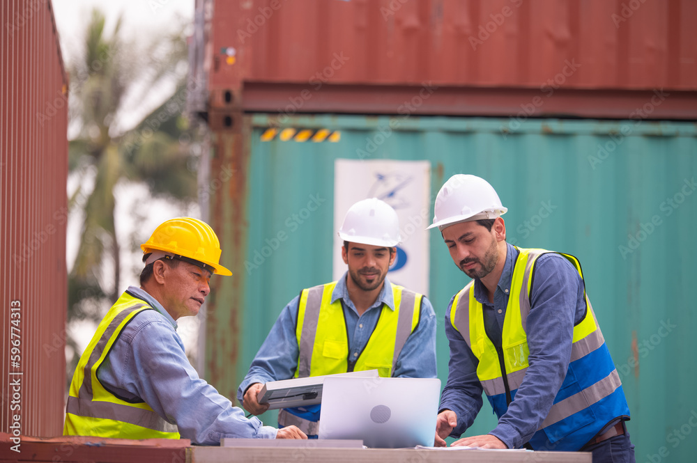 Solar power engineer meeting team at container background, Solar cell workers team talking in meeting Solar power engineer meeting team at container background, Solar cell workers team talking in meeting