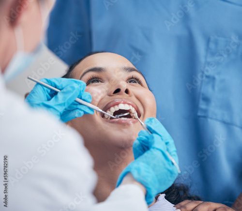 Her smile is what matters most. Shot of a young woman having a dental checkup.