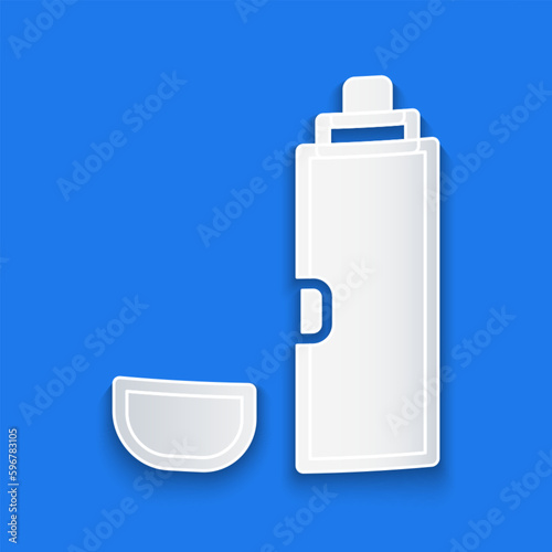 Paper cut Thermos container icon isolated on blue background. Thermo flask icon. Camping and hiking equipment. Paper art style. Vector