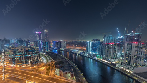 Skyscrapers at the Business Bay aerial night timelapse in Dubai  United Arab Emirates