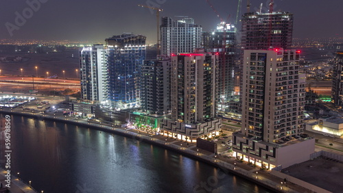 Towers at the Business Bay aerial day to night timelapse in Dubai, United Arab Emirates