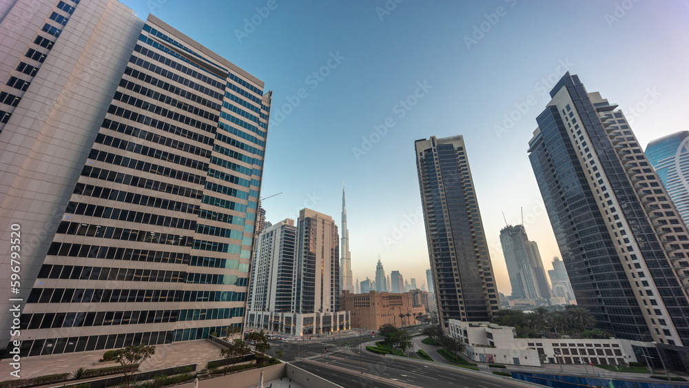 Aerial panoramic looking up view to Dubai downtown and difc skyscrapers night to day timelapse. Aerial panoramic looking up view to Dubai downtown and difc skyscrapers night to day timelapse.