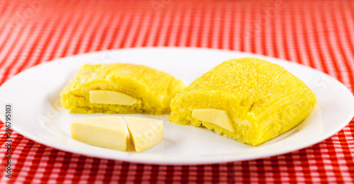 Pamonha, Brazilian sweet corn with cheese filling. Pamonha typical of Brazil, Concept of traditional food. Brazilian food at rural parties in June and July. photo