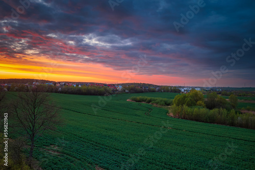 Amazing sunset over the spring fields of Rotmanka  Poland