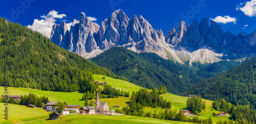 The church of Santa Maddalena and The Odle Mountain Peaks In Background, Panoramic View, Dolomites, Val di Funes, South Tyrol, Italy photo
