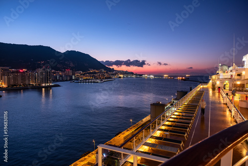 The rock of Gibraltar shot at sunrise from open deck of cruise liner