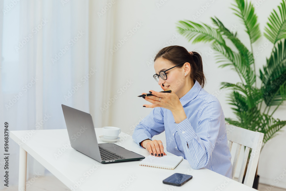 communication a woman in glasses at the computer at a remote work internet conversation online communication a woman in glasses at the computer at a remote work internet conversation online
