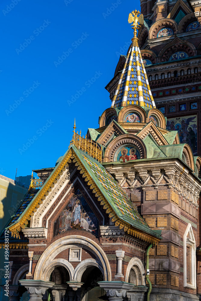 Entrance of Church of the Savior on Spilled Blood (also known as Tserkovʹ  Spasa na Krovi) in sunny day in Saint Petersburg city, Russia. Clear blue sky. Religious arhitecture. Travel in Russia theme