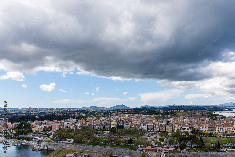 Thick clouds over the city. A beautiful landscape of the island of Corfu in Greece. 