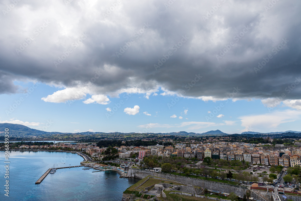 Thick clouds over the city. A beautiful landscape of the island of Corfu in Greece. 