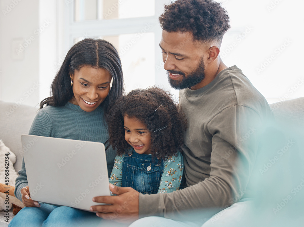 The most important thing in the world is family. Shot of a family using a laptop at home. The most important thing in the world is family. Shot of a family using a laptop at home.