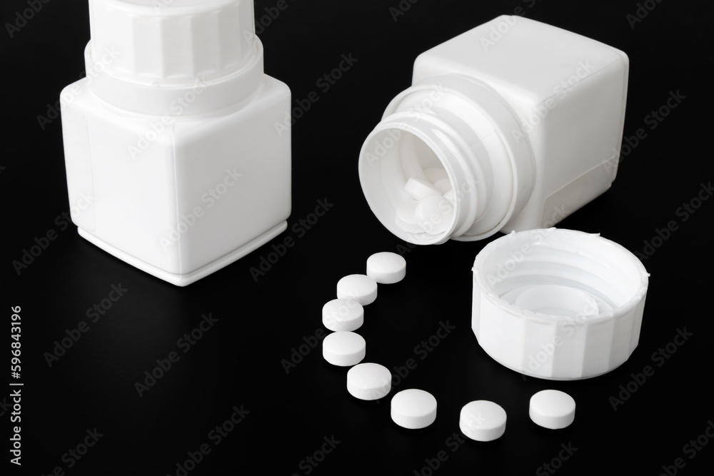© OLEKSANDR - Tablets, Opened bottle of medicine pills © OLEKSANDR - Tablets, Opened bottle of medicine pills