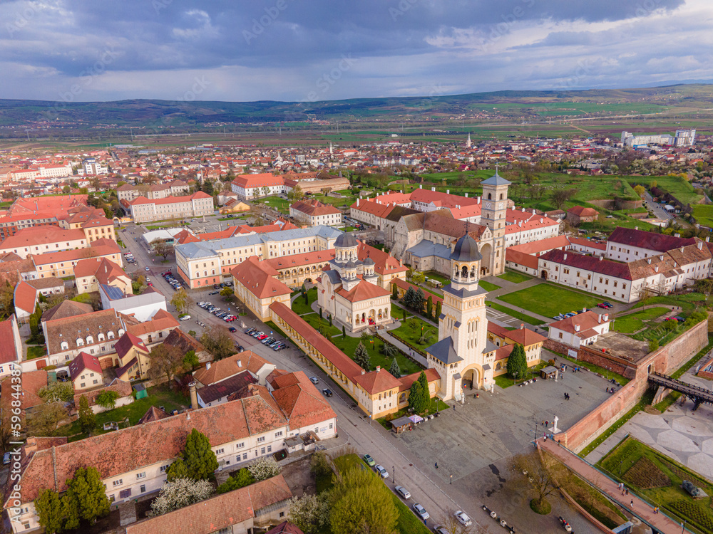 Aerial view of the Alba Carolina citadel located in Alba Iulia, Romania. In the photography can be seen the Reunification Cathedral from above, shot from a drone with camera level for a panoramic view