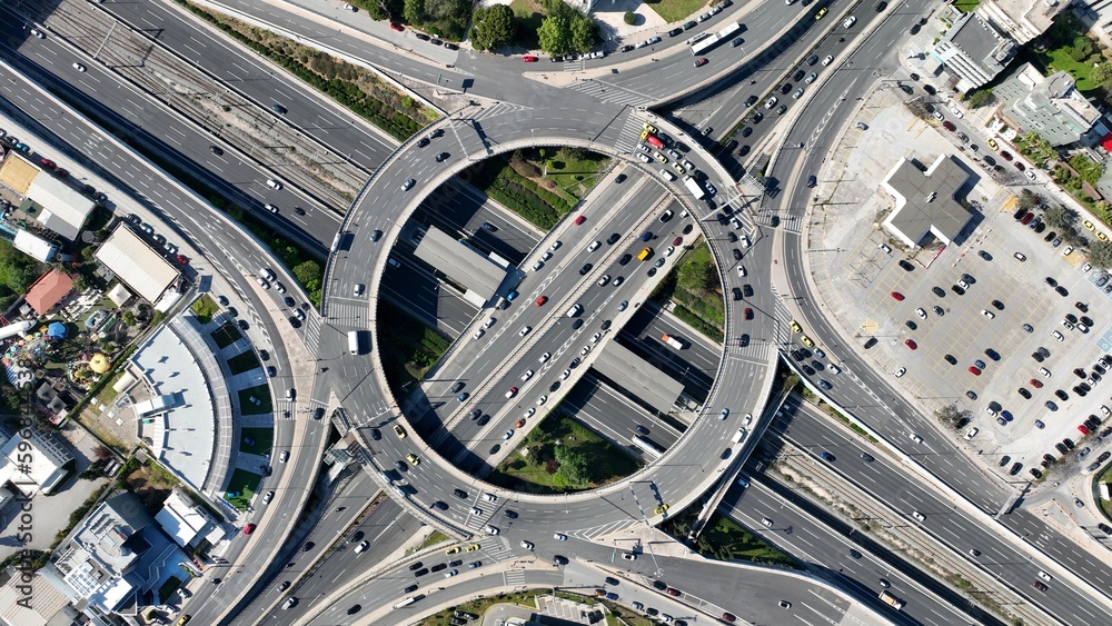 Aerial drone photo of multilevel circular ring road junction passing through urban city centre connecting National motorway and popular avenue Aerial drone photo of multilevel circular ring road junction passing through urban city centre connecting National motorway and popular avenue