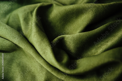 The texture of the green velvet fabric. Textile