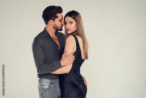Photo of elegant couple. Handsome man posing with attractive woman. Love.Date. Valentines day.