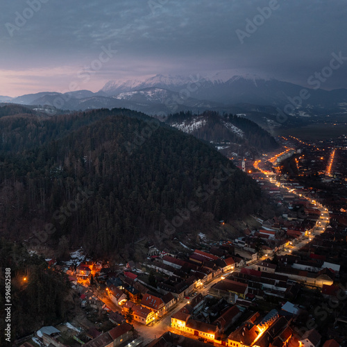 Dramatic aerial view of a road in Rasnov, Transylvania, at sunrise 