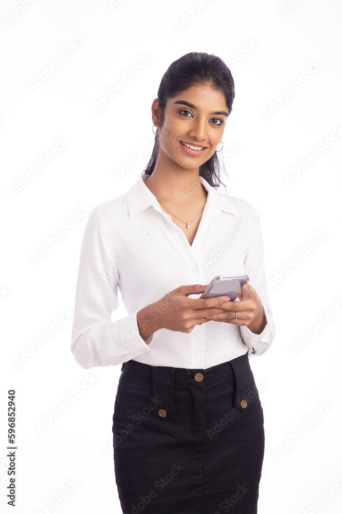 Pretty business woman using smartphone isolated on white. Pretty business woman using smartphone isolated on white.