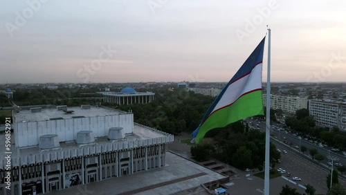 Aerial view of Majestic Uzbekistan National Flag at the Bunyodkor square in Tashkent city photo