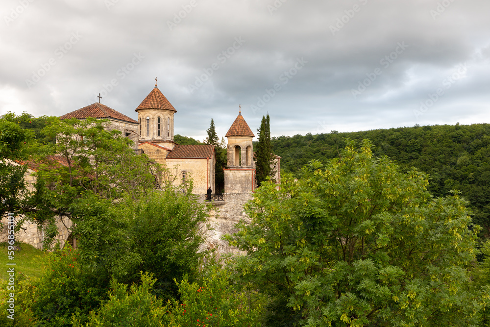 Motsameta monastery, XI century medieval stone orthodox church located on a cliff among lush forests in Georgia, Imereti Region.